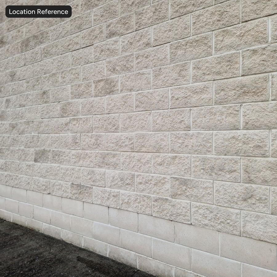 Texture de mur en blocs de béton à parement divisé