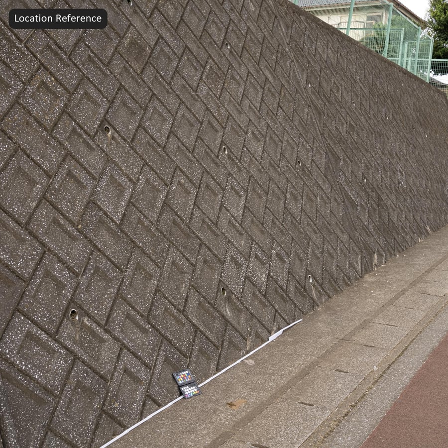 Texture de mur de soutènement en béton à chevrons en granulats estampés