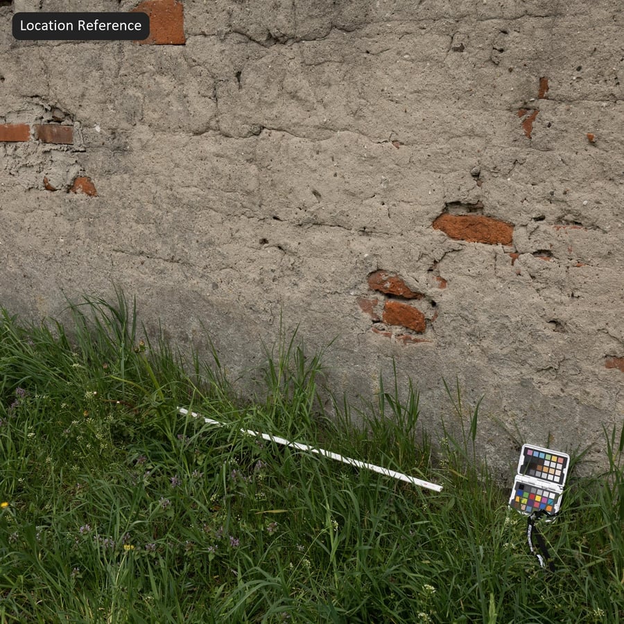 Texture di muro in mattoni intonacati usurati, grigio e rosso