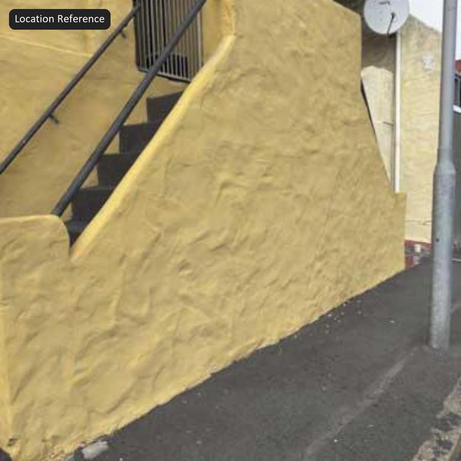 Texture parete in stucco con spatolatura a vortice, giallo dorato