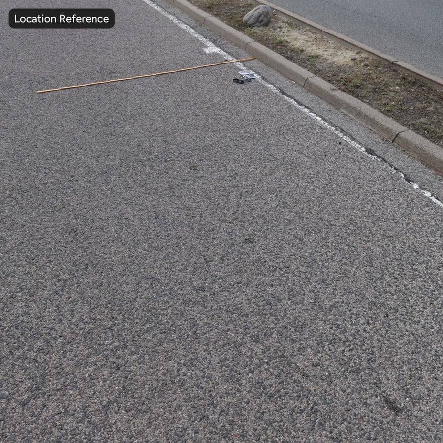 Blass gesprenkelte Asphaltstraßentextur